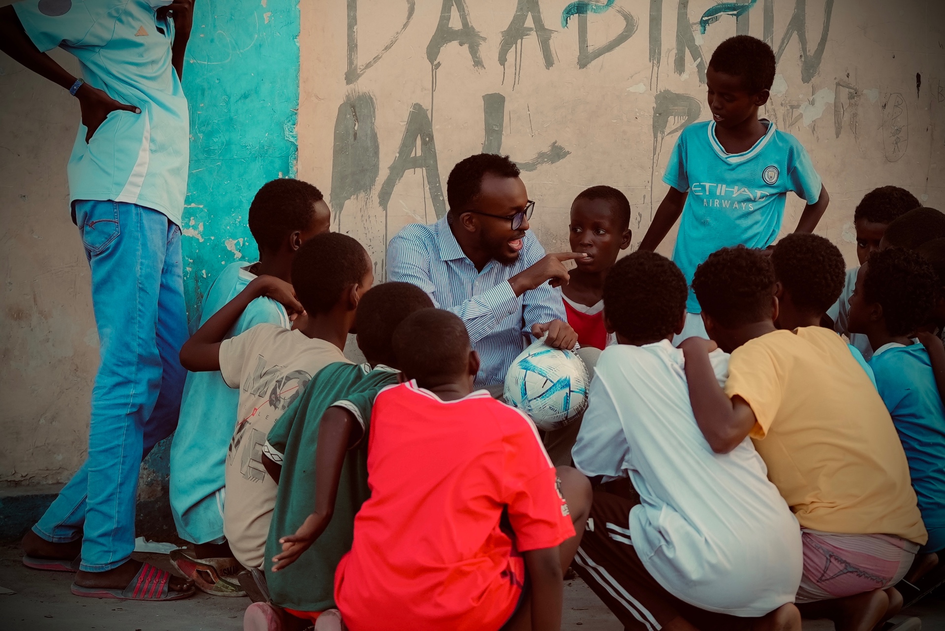 Coach leading a youth football session in Mogadishu